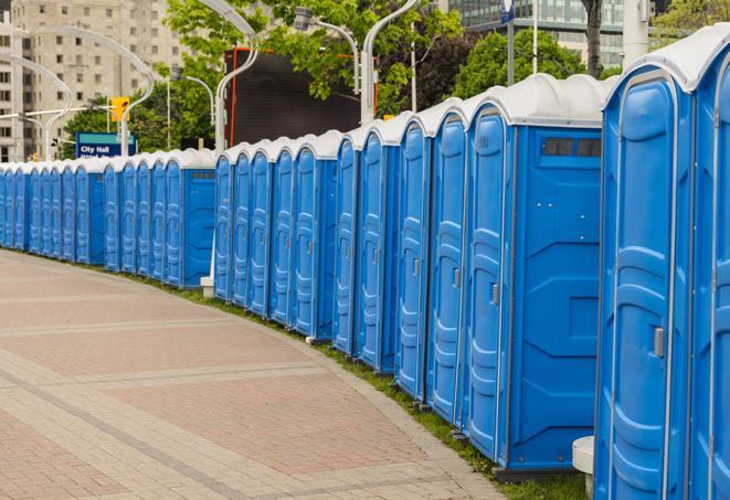 portable restrooms with sink and hand sanitizer stations, available at a festival in Altamonte Springs